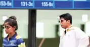  ?? — PTI ?? Manu Bhaker (left) and Saurabh Chaudhary react during the 10m Air Pistol Mixed Team event on Tuesday.