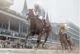  ?? MORRY GASH/ AP ?? Mike Smith rides Justify to victory by 21⁄2 lengths Saturday at the 144th running of the Kentucky Derby at Churchill Downs.
