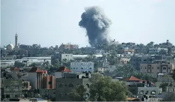  ?? (Mohammed Salem/Reuters) ?? SMOKE RISES following an Israeli air strike in the northern Gaza Strip last week.