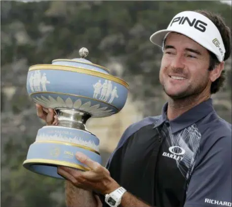  ?? THE ASSOCIATED PRESS ?? Bubba Watson holds his trophy after winning the during the final round at the Dell Technologi­es Match Play golf tournament Sunday.