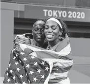  ?? Associated Press ?? Kinkaid’s Raevyn Rogers, right, shown with Athing Mu, took home bronze in the women’s 800 meters.