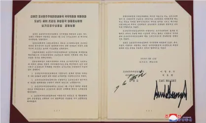  ?? Photograph: kcna/EPA ?? A photo released by the official North Korean Central News Agency (KCNA) shows the agreement signed by Korean leader Kim Jong-un and US president Donald Trump in Singapore on Tuesday.