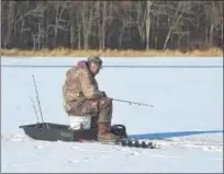  ?? PETE BANNAN — DIGITAL FIRST MEDIA ?? Bill Mendenhall of Downingtow­n ice fishes at Marsh Creek State Park Tuesday. The water depth where he was fishing he estimated was 10 feet with 5 inches of ice.