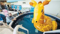  ?? JULIE JOCSAK
TORSTAR ?? Jay Pritchard, a partner of Boldt Pools in St. Catharines, left, and salesperso­n Bill Hendle say with municipal pools and beaches closed for the summer, sales of inflatable pools are through the roof.