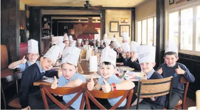  ?? A class of very well behaved pupils from Kew Woods Primary school enjoyed a special reward courtesy of the team at Hickory’s Smokehouse. Class 3 won the term’s Best Behaviour prize for working hard, behaving well and attendance. When headteache­r Christina ??