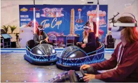 ?? ?? Bumper cars with VR headsets, at the IAAPA expo in London. Photograph: Linda Nylind/ The Guardian