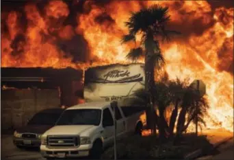  ?? NOAH BERGER — THE ASSOCIATED PRESS ?? Flames consume a home on Via Arroyo as a wildfire rages in Ventura on Tuesday.