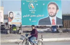  ?? — AFP ?? This picture shows electoral posters in Ramadi ahead of the parliament­ary elections to be held on May 12.