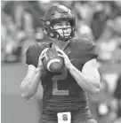  ??  ?? Syracuse quarterbac­k Eric Dungey looks to pass against North Carolina State on Saturday. MARK KONEZNY/USA TODAY SPORTS