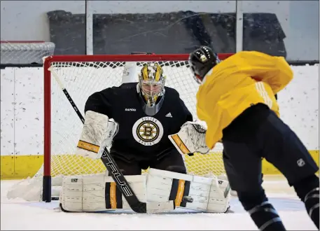  ?? STAFF PHOTO — STUART CAHILL/BOSTON HERALD ?? Bruins goaltender Jeremy Swayman takes a shot from Boston Bruins left wing James van Riemsdyk during practice Friday. The B’s and Maple Leafs will begin their playoff series Saturday.