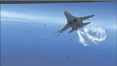  ?? VIA AP PHOTO ?? This photo taken from video released on Thursday shows a Russian Su-27 approachin­g the back of the MQ-9 drone and beginning to release fuel as it passes, over the Black Sea, the Pentagon said.
