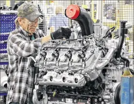  ?? TY GREENLEES / STAFF ?? Gary Gillman works on a 6.6-liter Duramax diesel engine in Moraine. Last year, General Motors and Isuzu announced an $82 million investment that would add 150 new jobs at the Moraine DMAX engine plant in the next few years.
