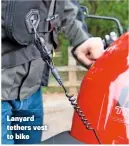 ??  ?? Lanyard tethers vest to bike