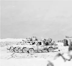  ??  ?? Hezbollah vehicles are seen in Jroud Arsal, Syria-Lebanon border. — Reuters photo