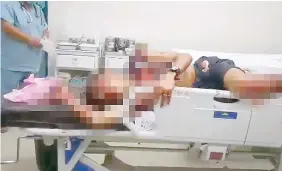  ??  ?? A grab from the video that went viral on social media shows drug suspect, Jimby Casas lying in the emergency room at Tuburan District Hospital.