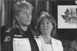  ?? FRED CHARTRAND, THE CANADIAN PRESS ?? B.C. Premier Christy Clark looks on as Marilyn Oberg of the B.C. Ambulance Service talks to reporters regarding the impact of opioid overdose on Parliament Hill, in Ottawa on Thursday.