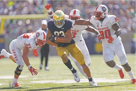  ?? PAUL SANCYA/ASSOCIATED PRESS FILE PHOTO ?? The Lobos traveled to South Bend, Ind., in 2019 to play Notre Dame. Beaten 66-14, UNM received $1.1 million for playing the game.