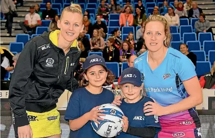  ??  ?? From left, Pulse captain Katrina Grant Plimmerton, young netballer Lily McClutchie and friend Hannah Penty, both 8, and Steel skipper Wendy Frew before the start of the ANZ Premiershi­p game in Porirua. Lily won the opportunit­y to lead the teams out...