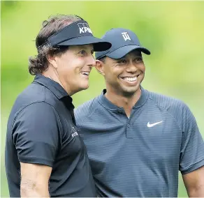  ?? — GETTY IMAGES ?? ESPN is reporting the much ballyhooed showdown between Phil Mickelson, left, and Tiger Woods will be held on U.S. Thanksgivi­ng weekend in late November in Las Vegas.