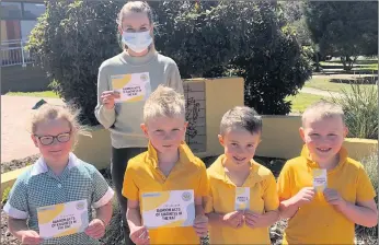  ?? ?? SPECIAL MESSAGE: Ararat West Primary School students, from left, Indra, Tucker, Archie and Oscar, with teacher Emily Hanns, plan some random acts of kindness ahead of Resilient Ararat’s new Mental Health Week campaign.