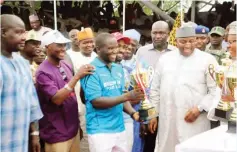  ??  ?? Bauchi State Governor, Mohammed Abubakar presents a cup to Haruna Ningi during the Prize Presentati­on ceremony of the recently concluded Bauchi polo tournament.