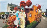  ?? GONG BIN/ XINHUA ?? Two people in traditiona­l Chinese opera costumes take part in the annual Flower Parade from Noordwijk to Haarlem in the Netherland­s on Saturday. The parade takes nearly 12 hours to travel the 42 kilometers between the cities.