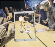  ?? DAVID PAUL MORRIS / BLOOMBERG ?? The ARKit, an augmented reality tool, is demonstrat­ed on an Apple Inc. iPad. Microsoft was first with a tablet, but Apple made theirs the market standard.