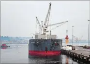  ?? SEAN D. ELLIOT/THE DAY ?? Workers at the Adm. Harold E. Shear State Pier unload road salt from the Marshall Islands-registered bulk carrier Erasmos on Jan. 22.