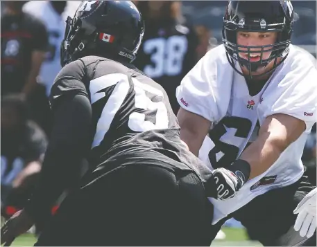  ?? JEAN LEVAC FILES ?? ”Everybody here is still taking it seriously,” says 2014-19 Redblacks member Nolan MacMillan, in white, “Nobody’s given up.”