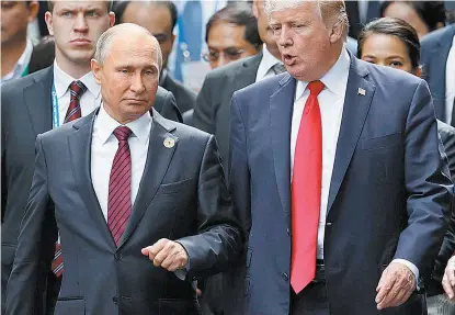  ??  ?? El republican­o con su par del Kremlin, Valdímir Putin.