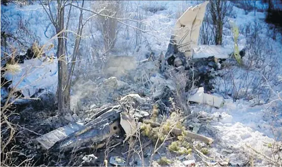  ?? COURTESY OF GLOBAL CALGARY ?? The remains of a Mount Royal University training aircraft, in which two flight instructor­s died, are scattered at a crash site north of Calgary.