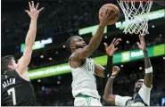  ?? STEVEN SENNE — THE ASSOCIATED PRESS ?? Boston Celtics’ Jaylen Brown, center, drives toward the basket as Milwaukee Bucks’ Grayson Allen, left, and Bobby Portis, right, defend during Game 7of their Eastern Conference semifinals series Sunday. The Celtics won.