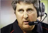  ?? ASSOCIATED PRESS FILE PHOTO ?? Texas Tech coach Mike Leach waits as a play is reviewed during the first quarter against Texas in Austin, Texas, Sept. 19, 2009.