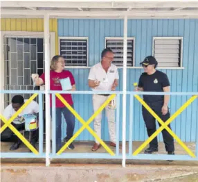  ?? ?? It’s obviously a labour of love for High Commission­er of Canada in Jamaica Emina Tudakovic; Sandals Dunn’s River General Manager Deryk Meany; and Commanding Officer Nicole Robichaud of the HMCS who joined volunteers in painting the Clapham Basic school in Moneague, St Ann.