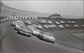  ?? ASSOCIATED PRESS 1979 ?? Cars are shown under one of the seven caution flags during the Daytona 500 on Feb. 18, 1979. Richard Petty led the field 12 times before his epic win.