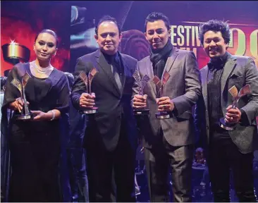  ??  ?? Munafik, directed by syamsul ( second from right) and produced by yusof ( third from right) won a total of five awards. Flanking them are the winners for Best Actress, Nabila, and Best Actor, pekin. — photos: FAIHAN GHANI/ The star