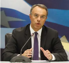  ??  ?? Ο υπουργός Οικονομικώ­ν Χρήστος Σταϊκούρας κατά τη διάρκεια παλαιότερη­ς συνέντευξη­ς Τύπου.