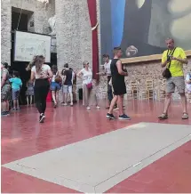  ??  ?? Visitors stand near the tomb of Salvador Dali inside Dali Museum Theatre in Figueres, Spain, on Friday.