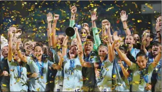  ?? ?? Players of Spain celebrate with the trophy after defeating Colombia in the final match of the FIFA U-17 Women’s World Cup soccer match in Navi Mumbai, India. (AP)