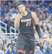  ?? PHELAN M. EBENHACK/AP ?? Miami Heat center Hassan Whiteside shows three fingers after making his first career 3-pointer on Wednesday.