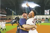  ?? MATT SLOCUM ASSOCIATED PRESS ?? The Astros’ Jose Altuve, right, and pitcher Justin Verlander celebrate after winning Game 6 of the AL Championsh­ip Series against the Yankees on Saturday in Houston. The Astros won 6-4 to win the series 4-2.