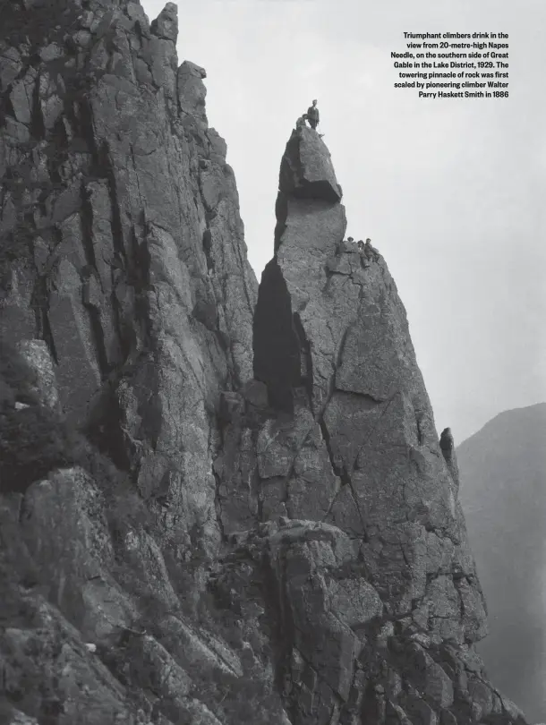  ??  ?? Triumphant climbers drink in the view from 20-metre-high Napes Needle, on the southern side of Great Gable in the Lake District, 1929. The towering pinnacle of rock was first scaled by pioneering climber Walter Parry Haskett Smith in 1886