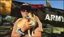  ??  ?? Bruce Dimmick and his dog Radar at the Yuba-sutter Veterans Stand Down on Friday.