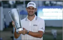  ?? NICK WASS — THE ASSOCIATED PRESS ?? Patrick Cantlay holds the trophy after winning the BMW Championsh­ip golf tournament, Sunday at Caves Valley Golf Club in Owings Mills, Md.