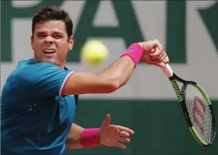  ?? CHRISTOPHE ENA, THE ASSOCIATED PRESS ?? Canada’s Milos Raonic plays a shot against Spain’s Pablo Carreno Busta during their fourth-round match of the French Open at Roland Garros Stadium in Paris. Raonic lost, 4-6, 7-6 (2), 6-7 (6), 6-4, 8-6.