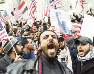  ?? PHOTO: ?? People participat­e in a Yemeni protest against President Donald Trump’s travel ban in Brooklyn. “We’re going to go out and support all our brothers and sisters who are detained in airports and in other countries that can’t get back,” Alaodyi said on...