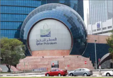  ??  ?? A view of the Qatar Petroleum (QP) headquarte­rs in Doha (file). QP remains at the heart of Qatar’s economy and social developmen­t.