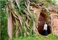  ?? AFP ?? A man looking at the temple in the ancient Sambor Prei Kuk complex in Kampong Thom province. —