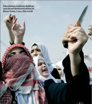  ??  ?? Palestinia­n students hold an anti-Israel demonstrat­ion in Khan Yunis, Gaza, this week