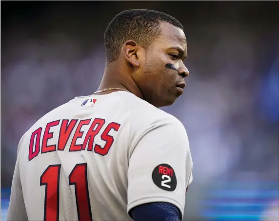  ?? JOHN MINCHILLO — THE ASSOCIATED PRESS ?? Boston Red Sox third baseman Rafael Devers stands on third base during an April 9, 2022 game against the Yankees.